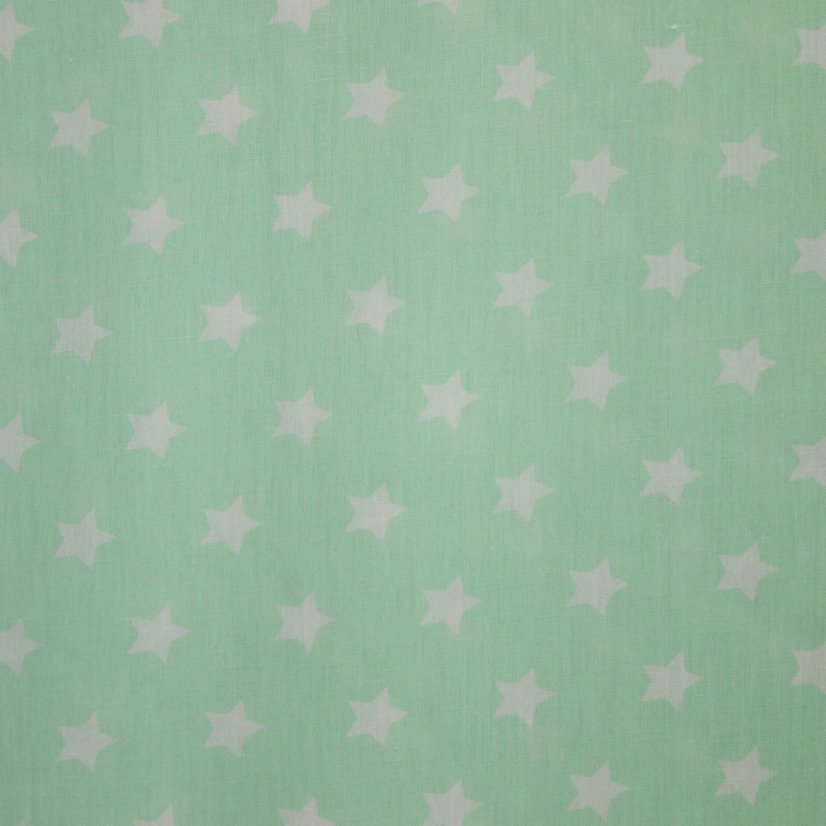 Katoen licht appelblauwzeegroen met kleine witte sterren